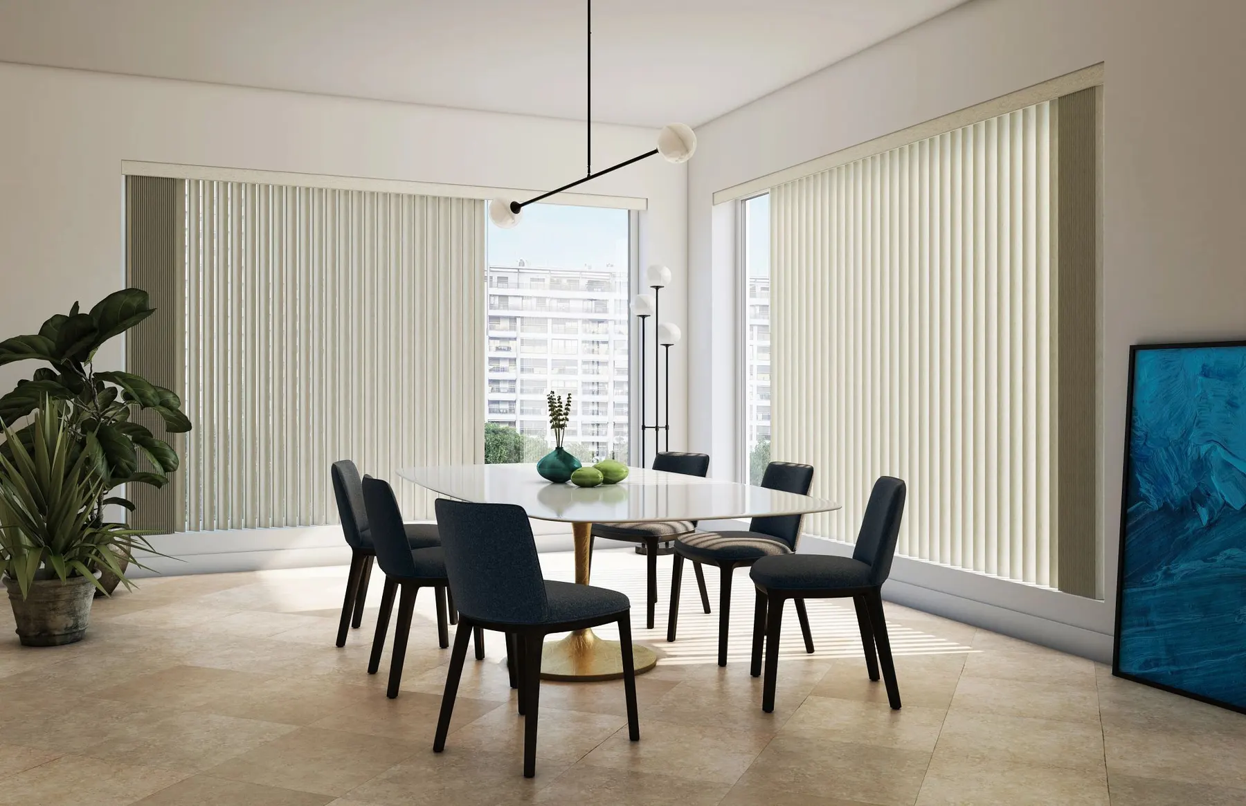 Cream vertical blinds across two walls of tall windows in a modern dining room with navy chairs.